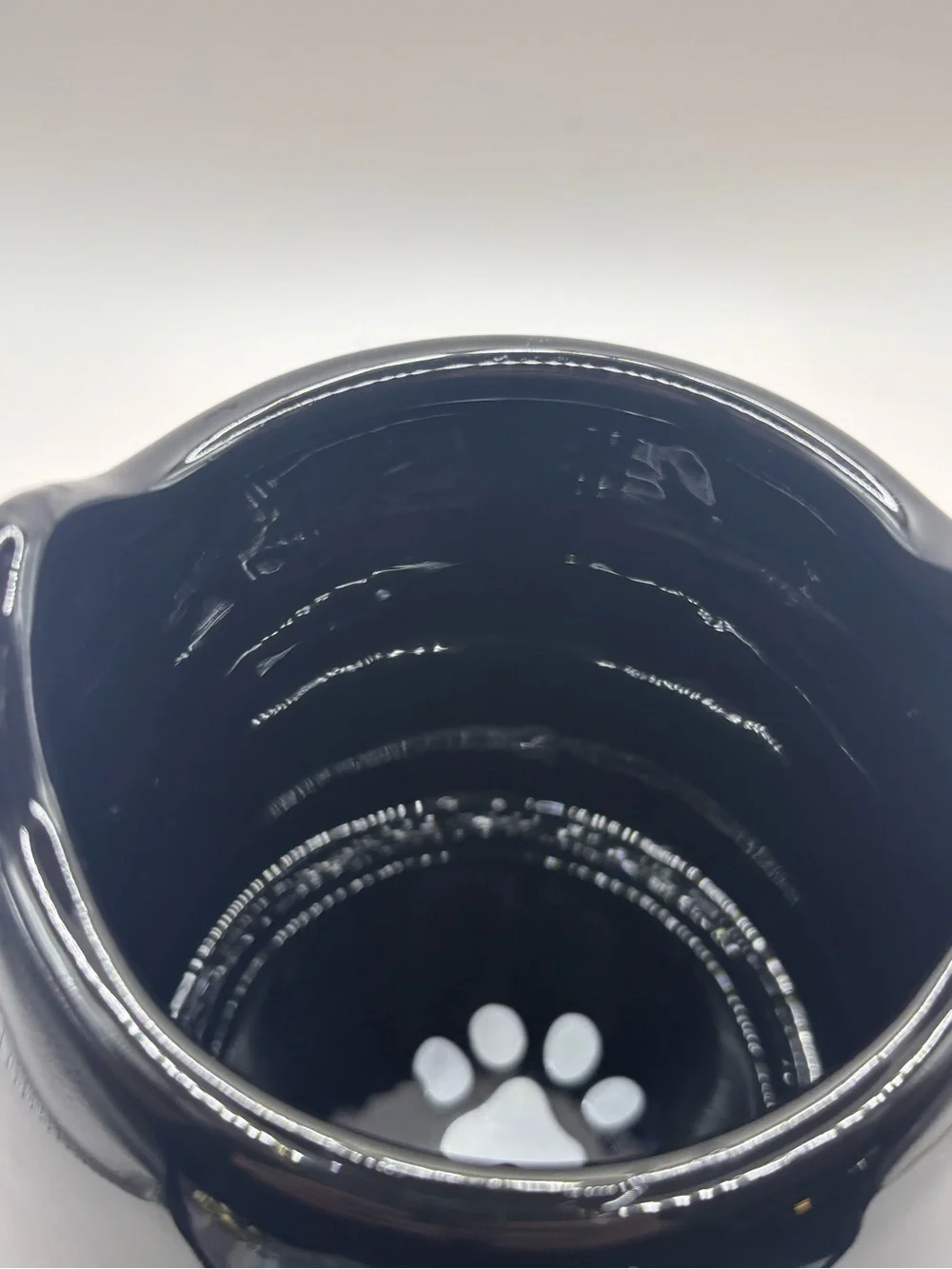 Very cute Ceramic Mug, Smiling Black Cat w Ears on Rim, Paw Print Inside.